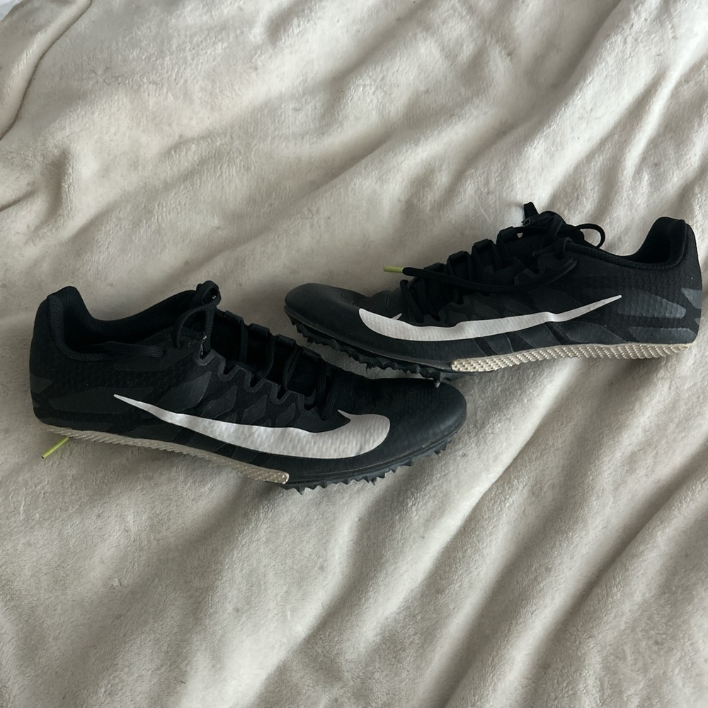 Women’s 10 black and white Nike Spikes